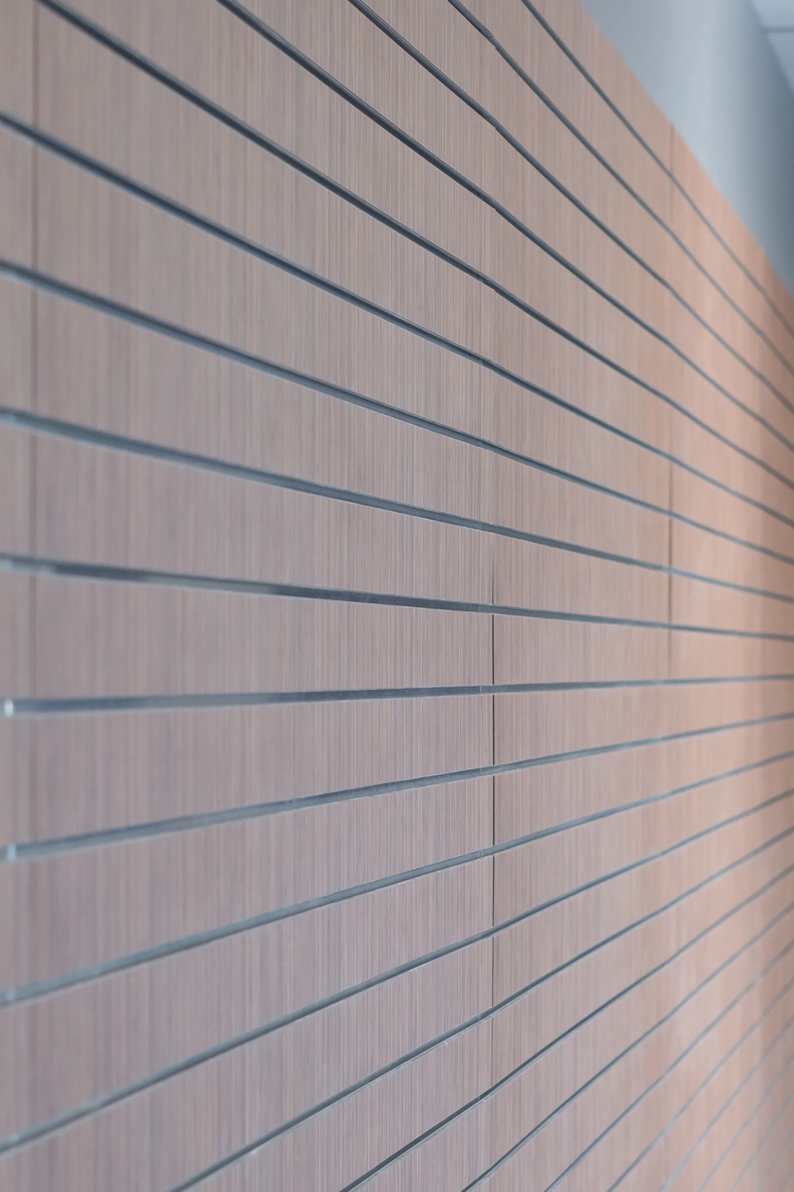 Wood-grain wall paneling with horizontal grooves