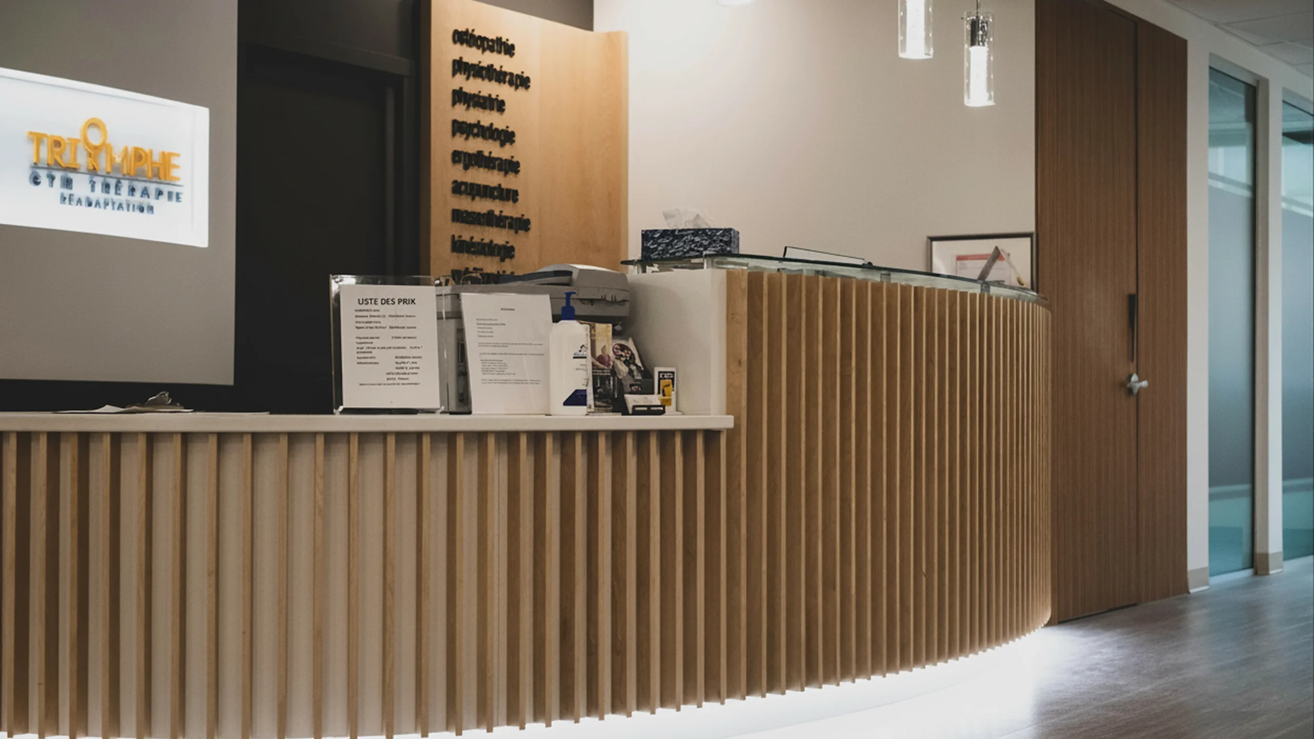 Curved reception desk with wood slats and underlighting