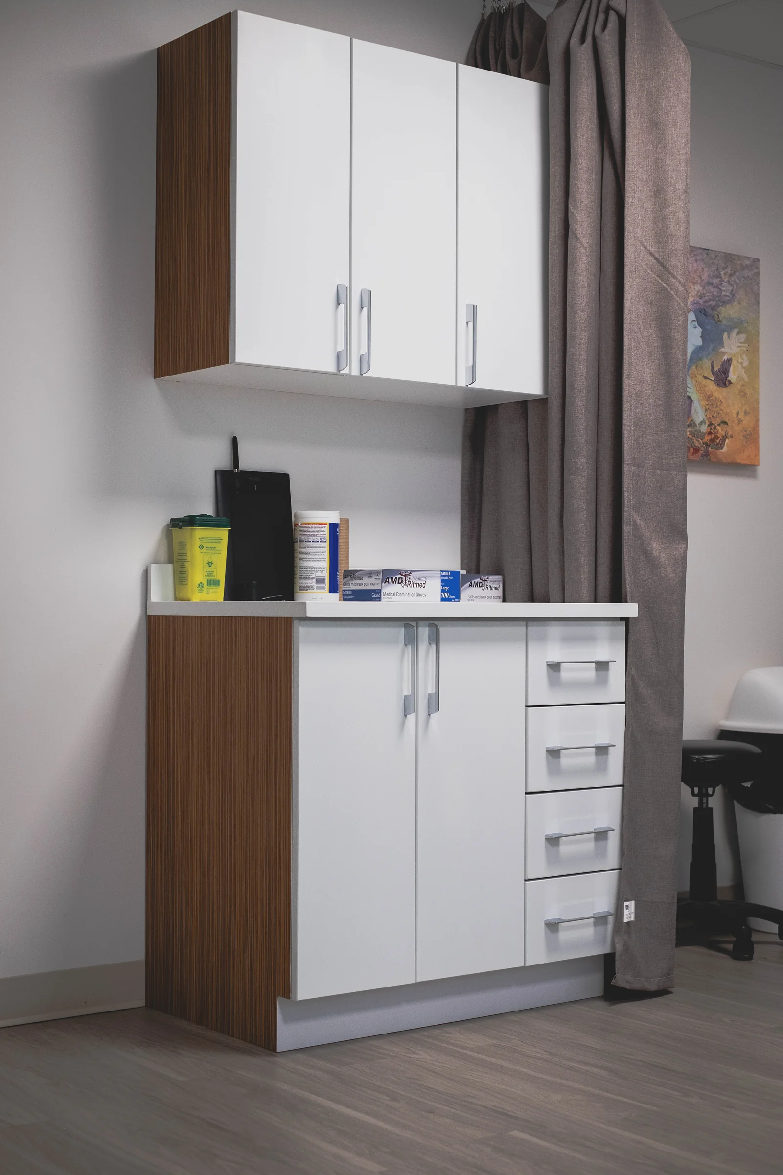 Custom cabinetry with wood grain accents in treatment area